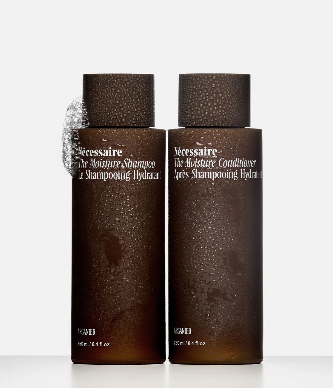 The Hair Moisture Duo, two brown bottles standing side by side