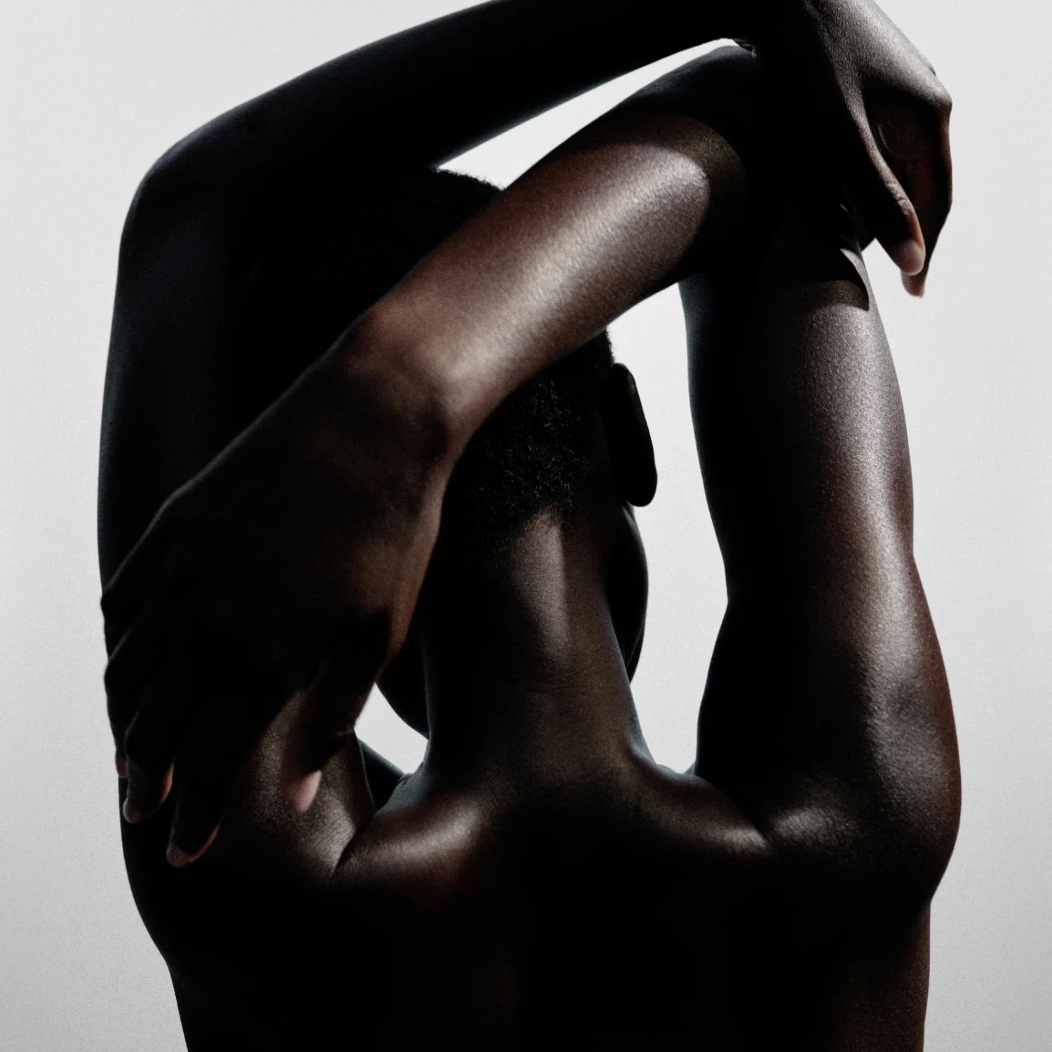 A model with an arm raised, shot in black and white, for the Bestsellers shelf